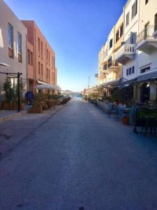 an empty street in a city with buildings at Casa Anthos free parking in Chania Town