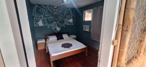 a small bedroom with a small bed in a room at Gugma Tiu Homestay Port Barton in Manila