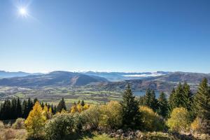 a view of the valley from the top of a mountain at Les Crocus - Magnifique Vue Montagne in Comboursière +6 photos
