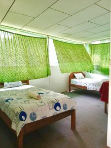 Postel nebo postele na pokoji v ubytování Aventour Expeditions Lodge