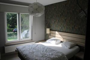 Un pat sau paturi într-o cameră la Chez Ines