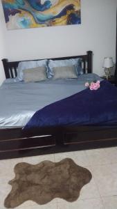 Ένα ή περισσότερα κρεβάτια σε δωμάτιο στο The Eli Villa