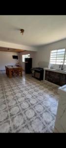 an empty living room with a ping pong table in it at Fazenda Torrão da Serra in Guarulhos +4 photos