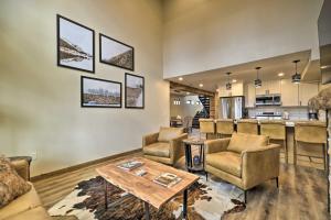 a living room with couches and a table and a kitchen at Luxury Red Lodge Retreat Hot Tub Downtown in Red Lodge
