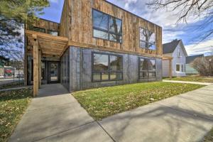 a house with a wooden facade on a street at Luxury Red Lodge Retreat Hot Tub Downtown in Red Lodge