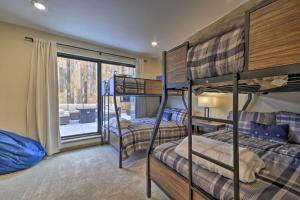 a bedroom with three bunk beds and a balcony at Luxury Red Lodge Retreat Hot Tub Downtown in Red Lodge