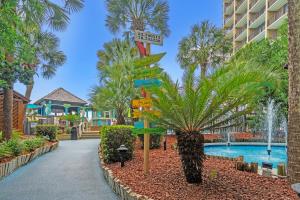 een straatnaambord voor een resort met een zwembad bij Beach Cove Resort Unit 625 Corner Condo with Direct Oceanfront Balcony in Myrtle Beach