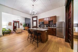 a kitchen with a large island in a room at The Plum Suite in Sedalia
