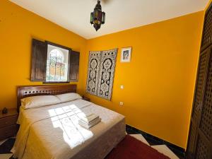 Postel nebo postele na pokoji v ubytování Kasbah Panoramic House with stunning sea view