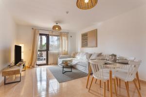 a living room with a couch and a table at Casa Piña Colada in Corralejo