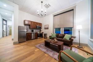a living room with a couch and a table at The Library in Sedalia