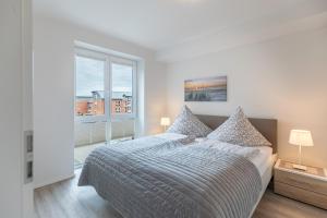 Кровать или кровати в номере Stadtlust 1