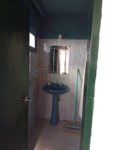 a bathroom with a sink and a window at Herminia Sol in La Aguada