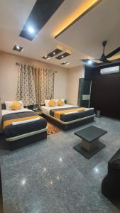 Ένα ή περισσότερα κρεβάτια σε δωμάτιο στο Kaziranga Guest House KOHORA