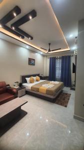 Ένα ή περισσότερα κρεβάτια σε δωμάτιο στο Kaziranga Guest House KOHORA