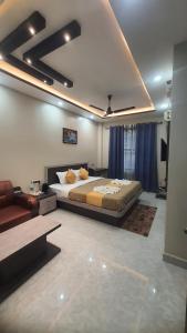 Ένα ή περισσότερα κρεβάτια σε δωμάτιο στο Kaziranga Guest House KOHORA