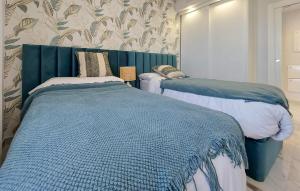 En eller flere senge i et værelse på Nice Apartment In Orihuela Costa