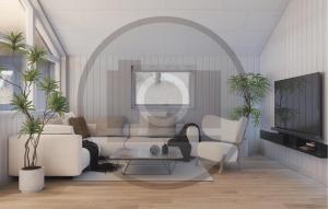 HasmarkNice Home In Otterup With Sauna的客厅里有一张沙发和一张桌子。