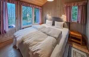 Ένα ή περισσότερα κρεβάτια σε δωμάτιο στο 4 Bedroom Nice Home In Trysil