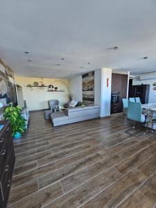 a living room with a couch and a table at Soulnest Peace bedroom in shared flat in Qbajjar +35 photos
