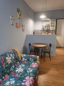 a living room with a couch and a table at Elegante Suite in Centro Torino · Self Check-in in Turin