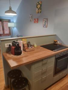 a kitchen with a counter with a sink and a stove at Elegante Suite in Centro Torino · Self Check-in in Turin +20 photos
