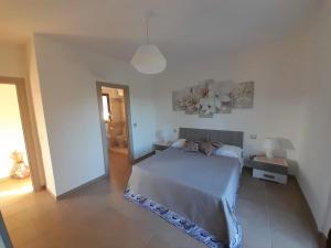 Ένα ή περισσότερα κρεβάτια σε δωμάτιο στο Agriturismo di lusso B&B Dileo Giovanni