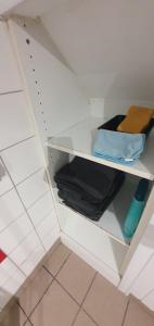 a white shelf in a bathroom with towels at Proche Puy du Fou - Petite maison tendance loft in Saint-Laurent-sur-Sèvre +15 photos