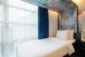 Postel nebo postele na pokoji v ubytování Eden Hotel Amsterdam