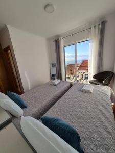 Ένα ή περισσότερα κρεβάτια σε δωμάτιο στο LandS