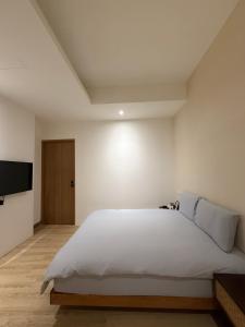 Ένα ή περισσότερα κρεβάτια σε δωμάτιο στο 浮生半盞 Ephemeral Stay