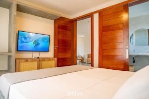 En eller flere senge i et værelse på Villa Makani no Shamballa by Qavi + 26 billeder