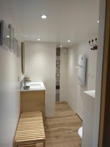 a small bathroom with a sink and a toilet at La Corentine in Bandol