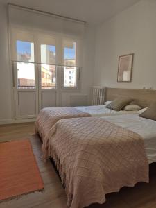 En eller flere senge i et værelse på NEW Apartamento céntrico P&M