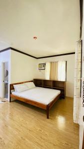 Un pat sau paturi într-o cameră la Zagami Homestay