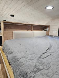 Ένα ή περισσότερα κρεβάτια σε δωμάτιο στο Tiny House Ingo John 'Vanessa'