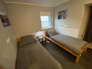 Ένα ή περισσότερα κρεβάτια σε δωμάτιο στο Adult only klimatisierte Ferienwohnung in Schwerte