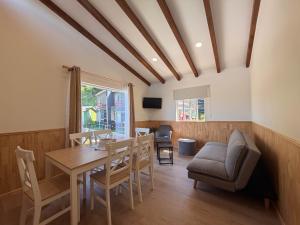 a dining room with a table and chairs at Cabañas Anahuac II in Puerto Montt
