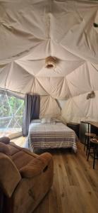 Ένα ή περισσότερα κρεβάτια σε δωμάτιο στο Domo Mañio +2 φωτογραφίες