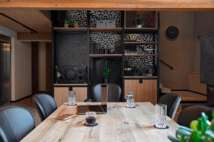 a conference room with a wooden table and chairs at Haus Filomena Oetz in Oetz