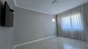 Et tv og/eller underholdning på Casa Vila Muriqui