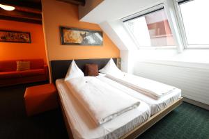 En eller flere senge i et værelse på Gasthaus Bären Kölliken