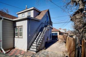 a blue and white house with a wooden fence at Capitol-Side • Downtown • Attic Harry-Potter Door in Cheyenne