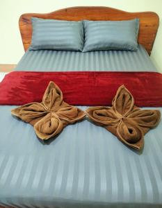 Postel nebo postele na pokoji v ubytování Lanta Orange House