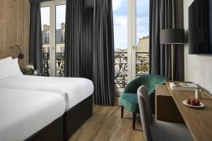 Ένα ή περισσότερα κρεβάτια σε δωμάτιο στο NH Paris Opéra Faubourg