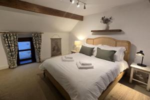 En eller flere senge i et værelse på Old Grocers Shop, Youlgrave