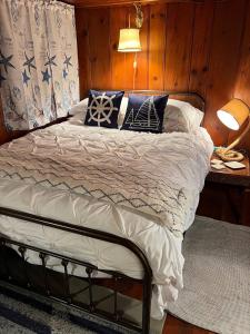 a bed with pillows on it in a room at Capitol-Side • Downtown • Basement Pirate Themed in Cheyenne