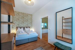 Ένα ή περισσότερα κρεβάτια σε δωμάτιο στο Downtown Apartments by Cosy Homes - Bahnhofsnähe