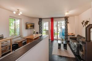 a living room with a couch and a table at Ferienhaus Kontraste 4m in Korswandt