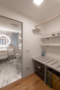 a bathroom with a sink and a mirror at The Golden Duo Two luxury units in one building by Aura Luxury Collection in Como